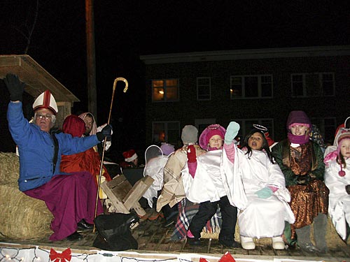 Bishop Don Harvey participates in the Pembroke, ON Christmas parade, riding on St Luke’s float